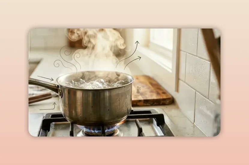 Pot boiling on a gas hob with steam rising